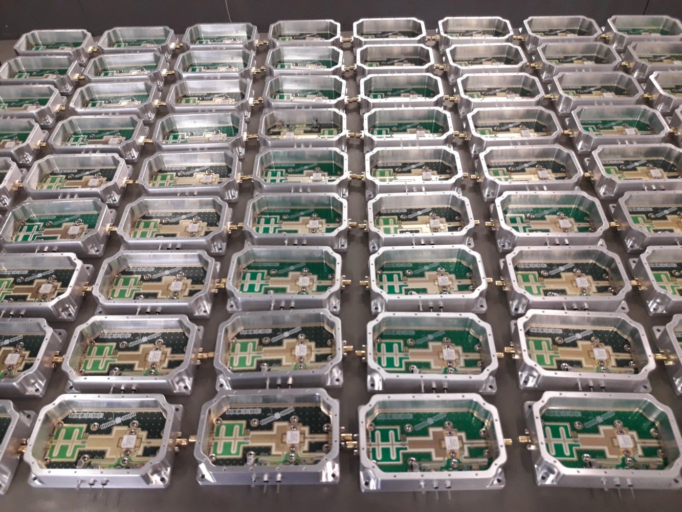 Rows of open E-REON RF amplifier modules during an in-house production batch